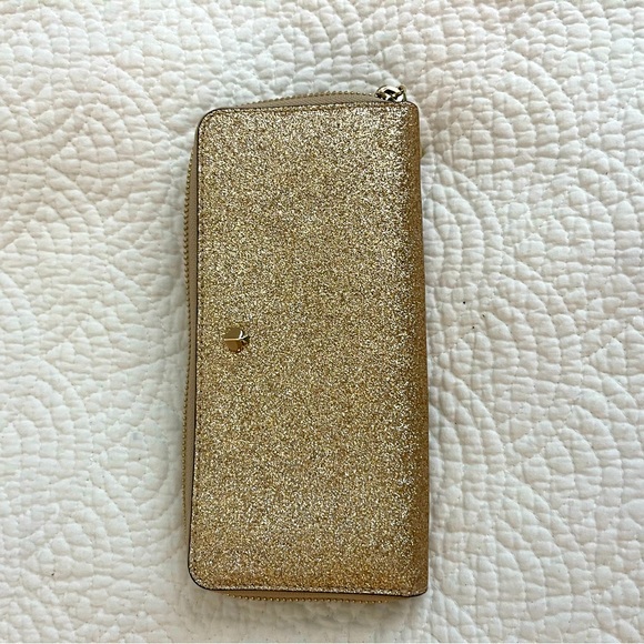 kate spade Handbags - Kate Spade Gold Glitter Zip Around Wallet